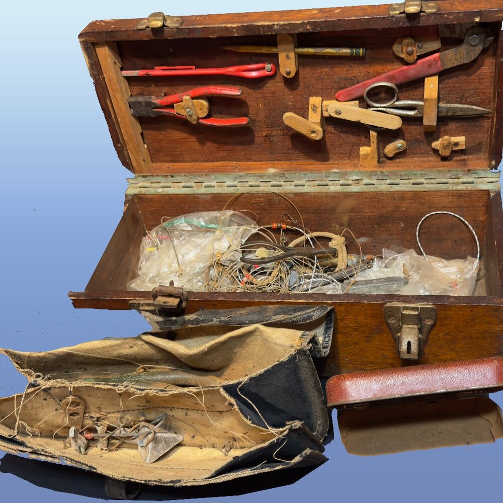Antique surveyor box with antique fishing tackle inside